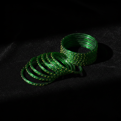 Dark green bangles on black velvet