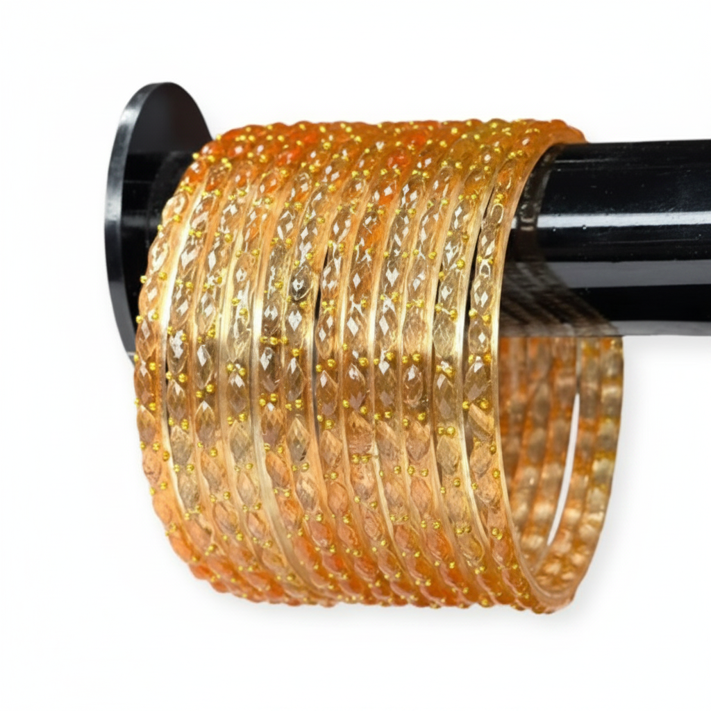 Close up of peach raindrop glass bangles