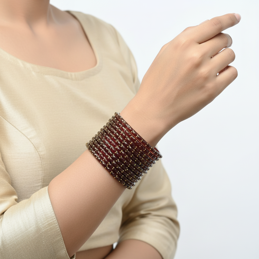 Maroon raindrop glass bangles on wrist